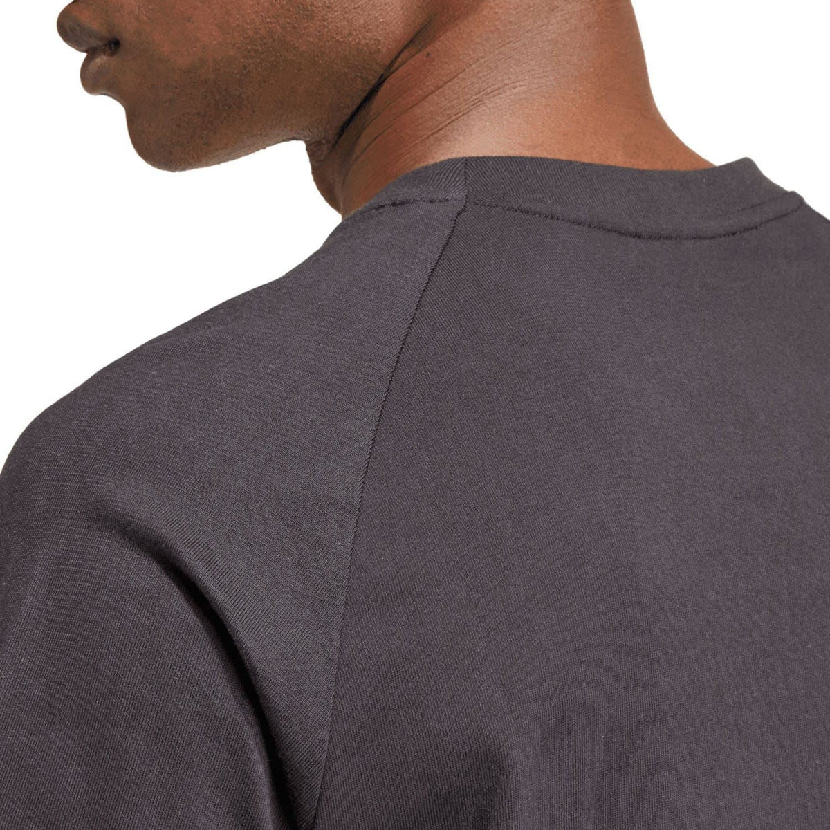 Black T-shirt shoulder and collar seam detail, short sleeves