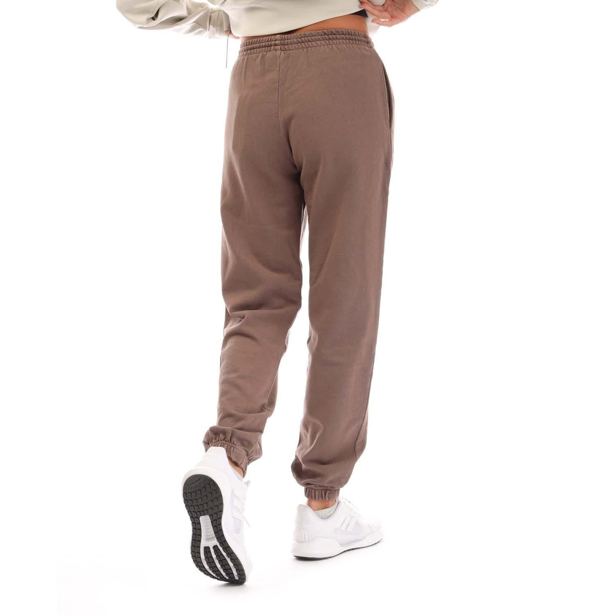 Brown adidas Originals joggers with drawstring waist and cuffed ankles