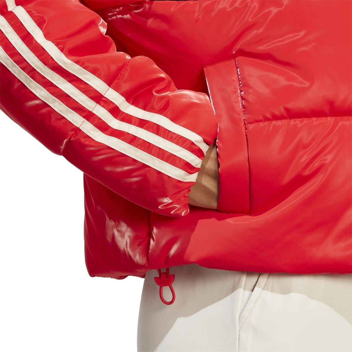 adidas Originals high-neck bomber coat featuring a sleek design, front zipper, and padded collar, perfect for stylish winter wear