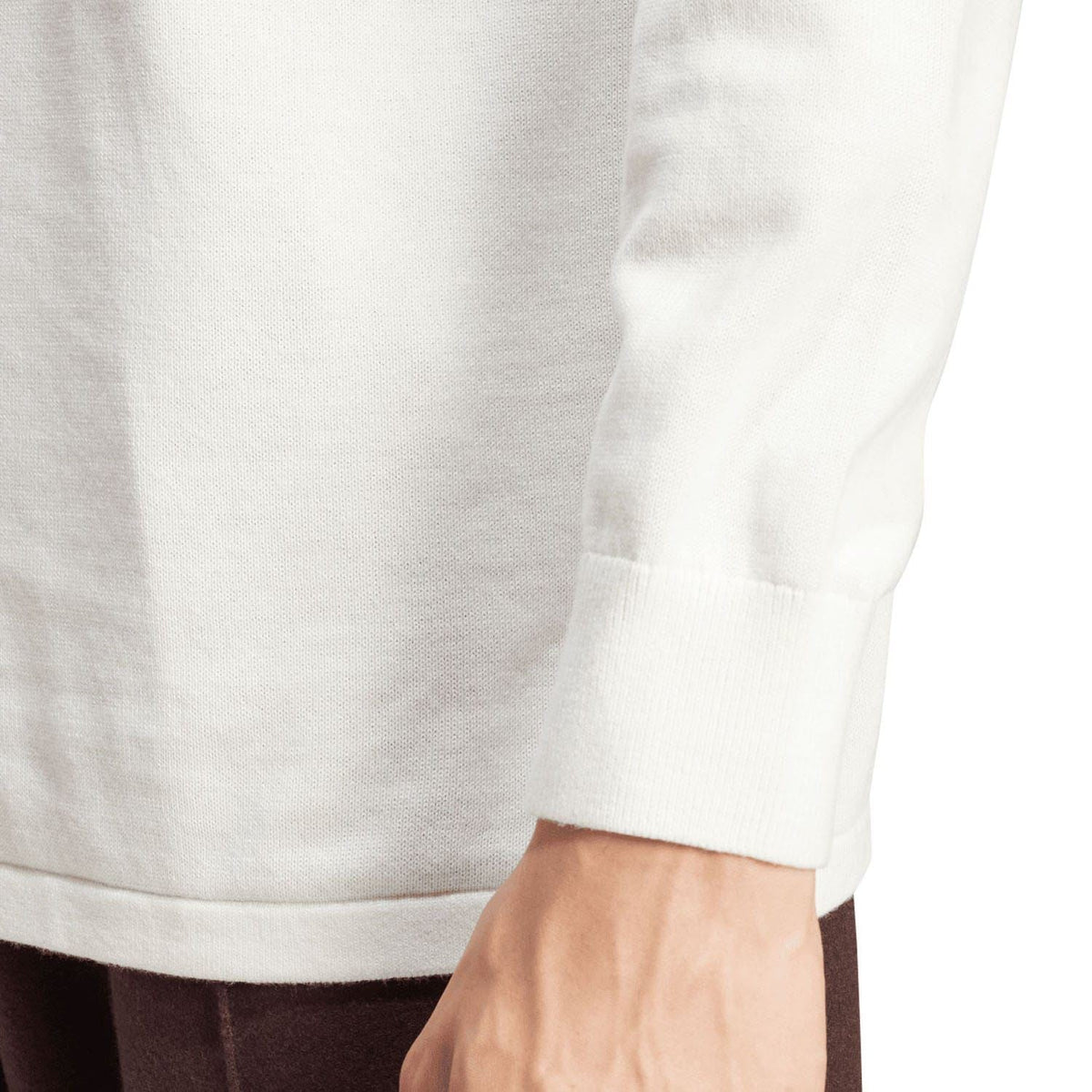 Off-white long-sleeve polo shirt sleeve cuff close-up with ribbed trim