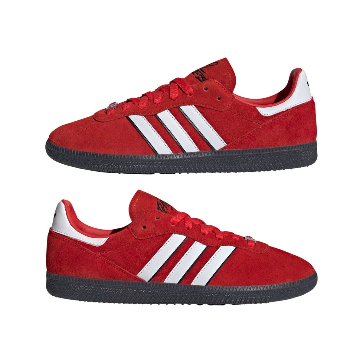 Pair of red suede low-top trainers with white adidas stripes and black sole