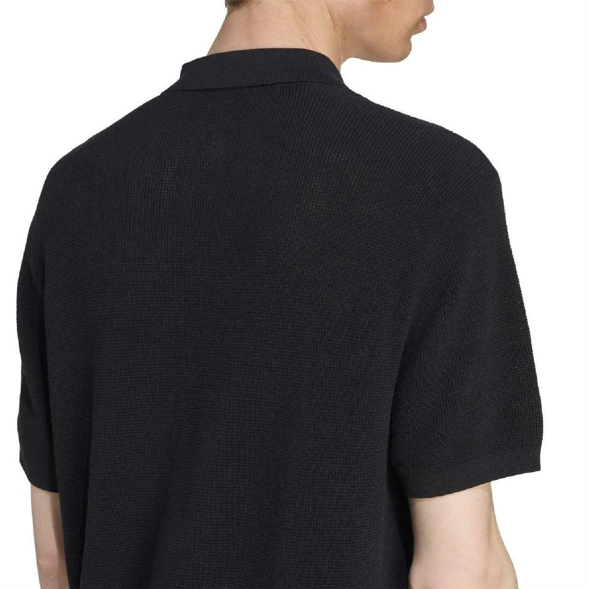 adidas Originals black polo shirt back close-up with ribbed neckline and knit texture
