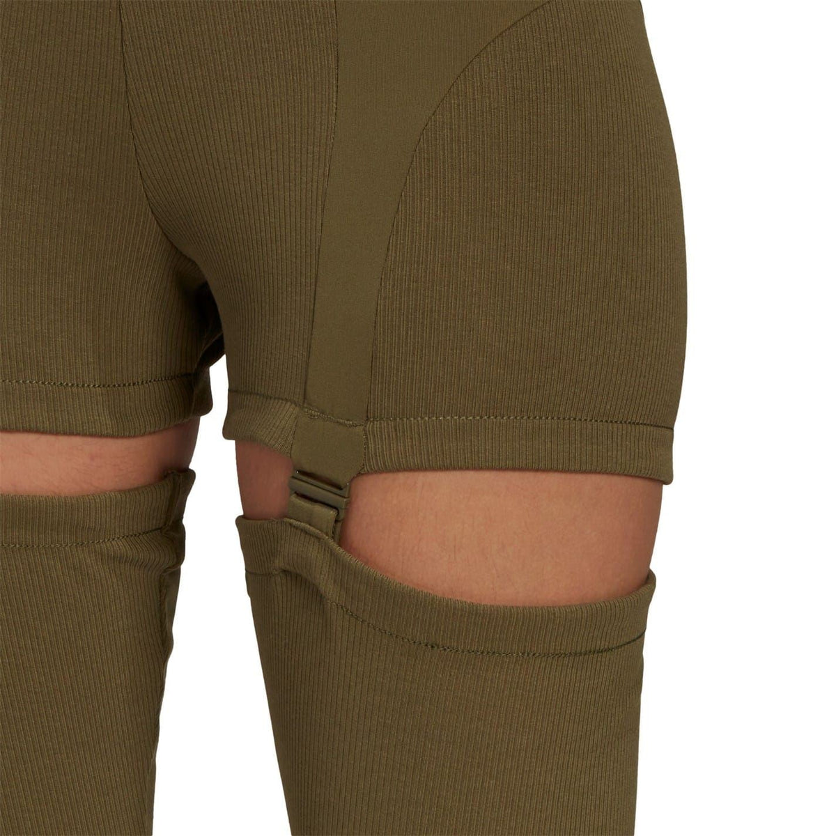 2-in-1 skinny fit leggings close-up: olive thigh short overlay with seam and strap