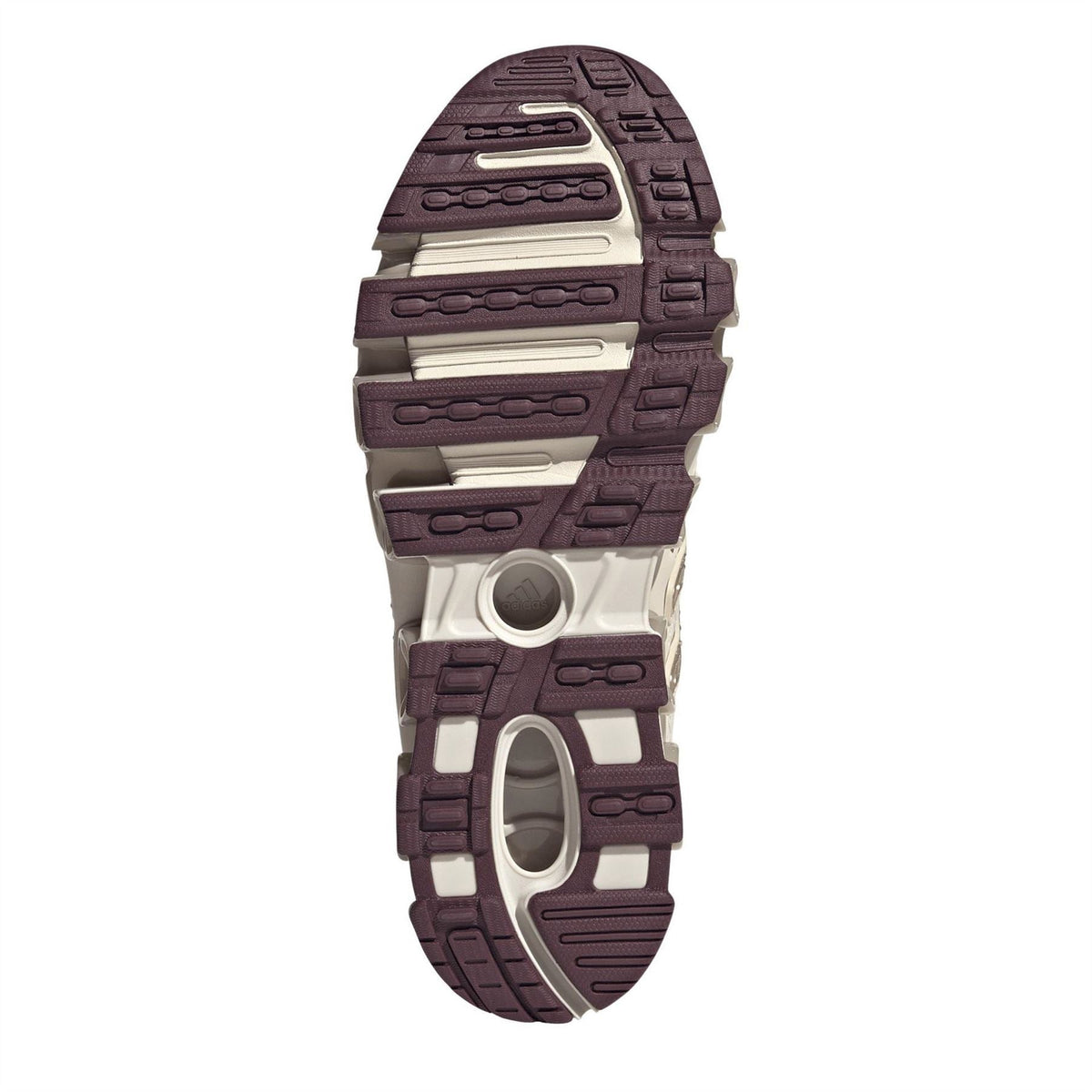Women's sneaker outsole with purple tread and circular traction details