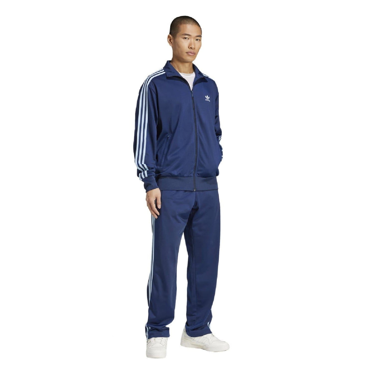 Indigo adidas Originals track set featuring a zipped track top and matching pants