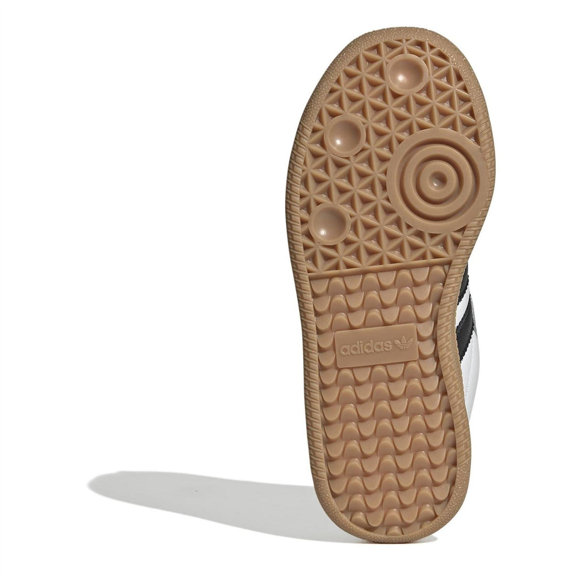 Kids gum rubber outsole with traction tread, underside view