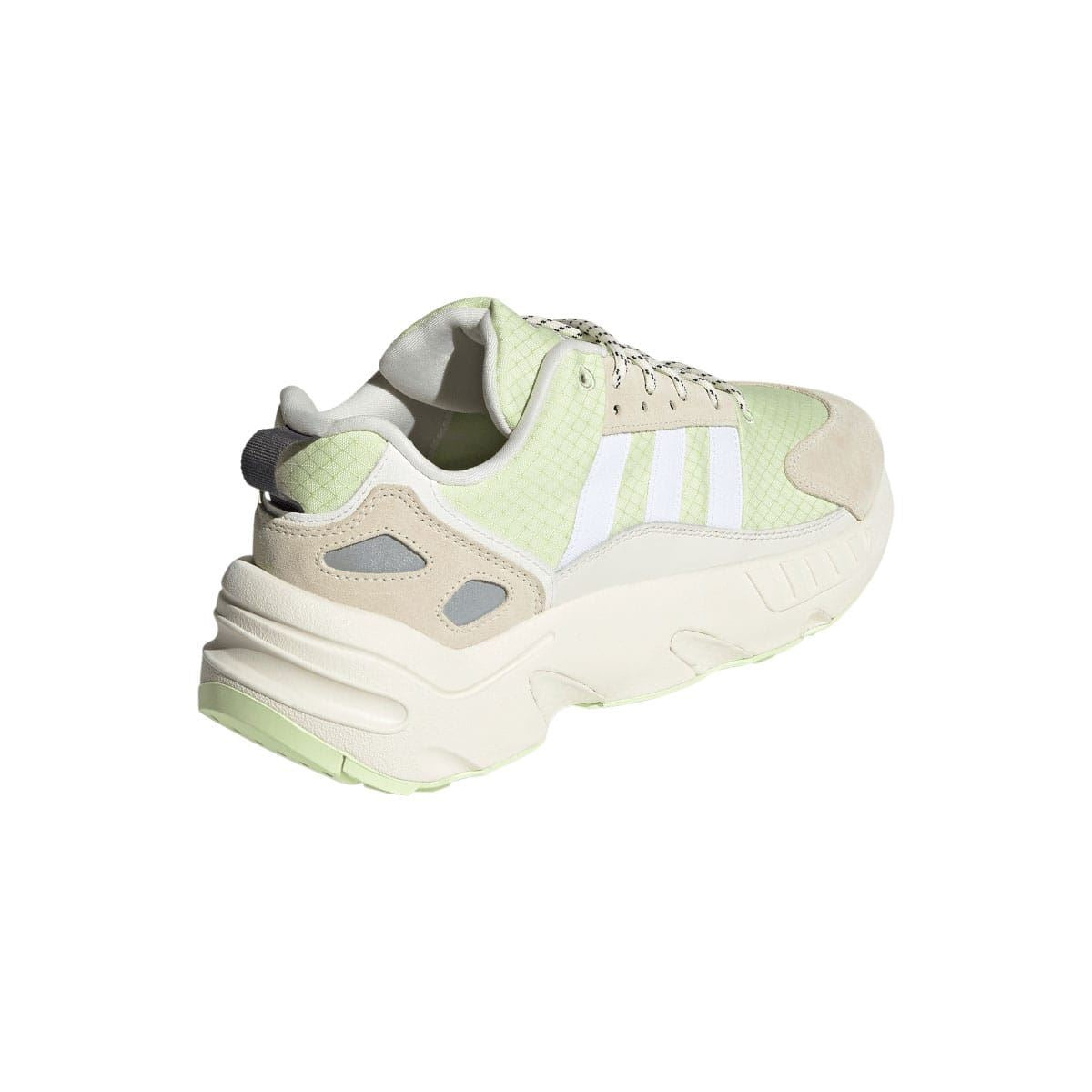 Back view of off white and light green trainers with padded collar and molded midsole
