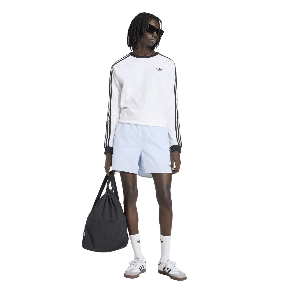 Light blue men’s shorts with elastic waist, above-knee length and Adidas trefoil logo