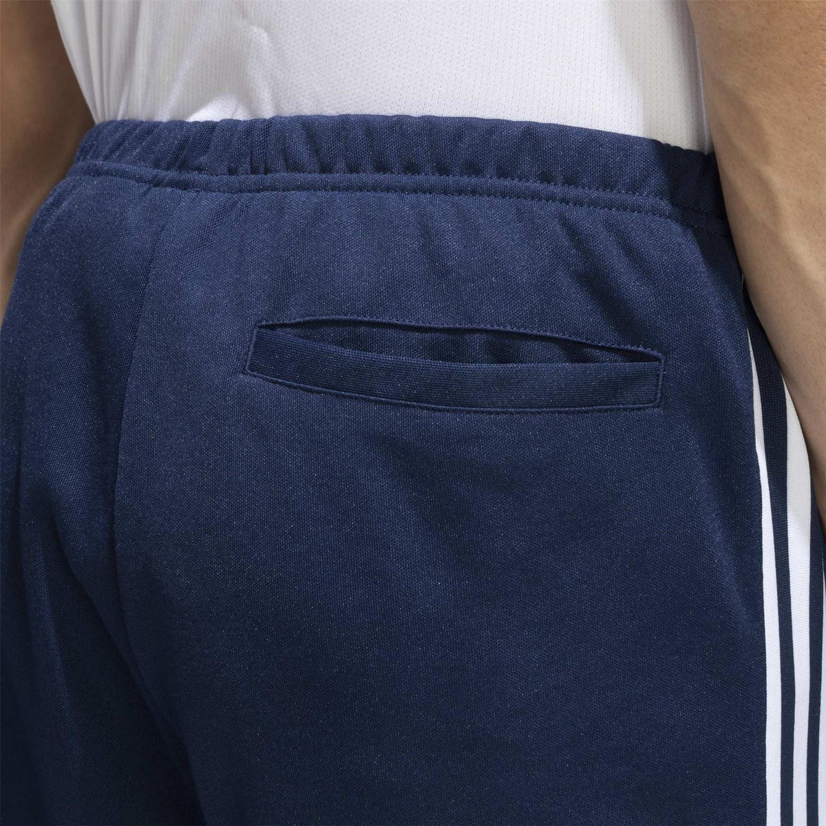 adidas track pants pocket detail: navy front zip pocket with white stripe edge