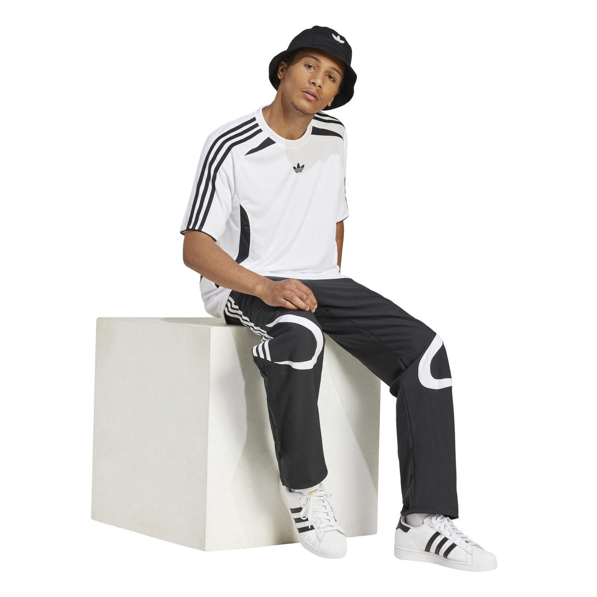 White adidas Originals tracksuit top with black shoulder stripes and chest logo
