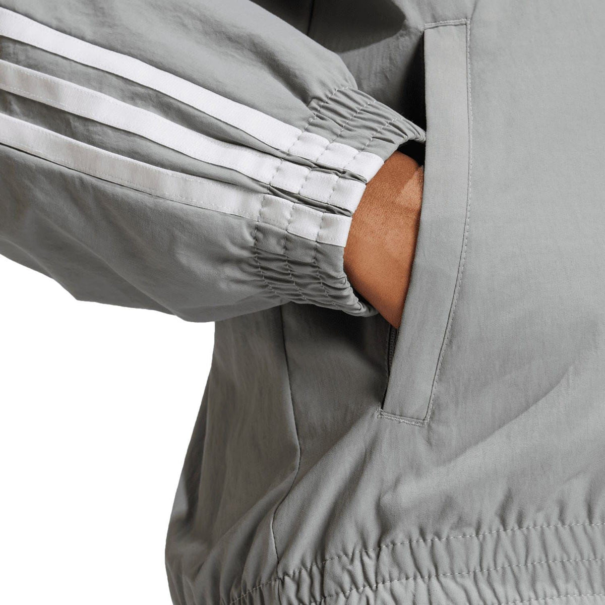 adidas Originals grey woven track jacket cuff and elastic hem close-up