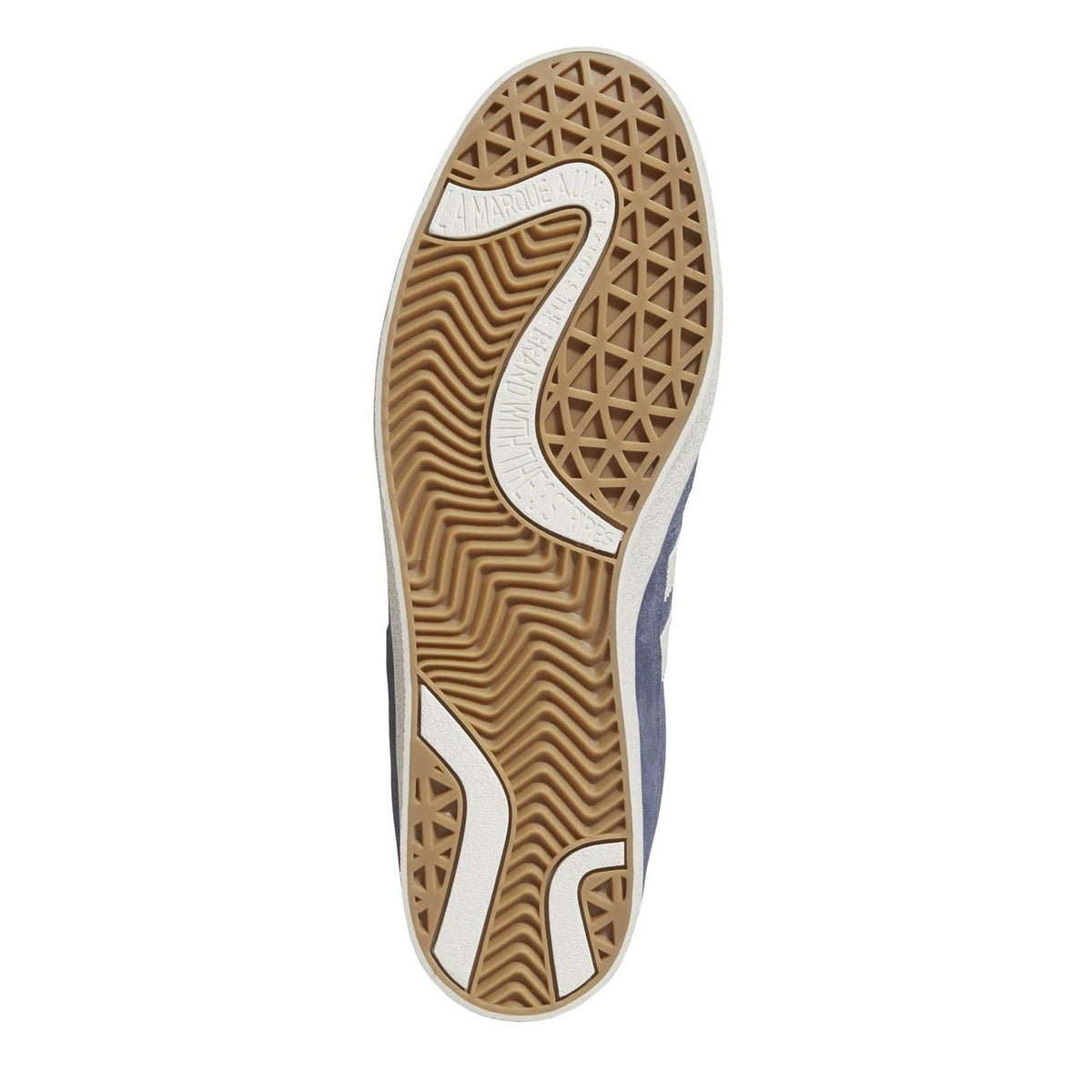 Indoor trainer outsole with patterned gum tread and side grip panels