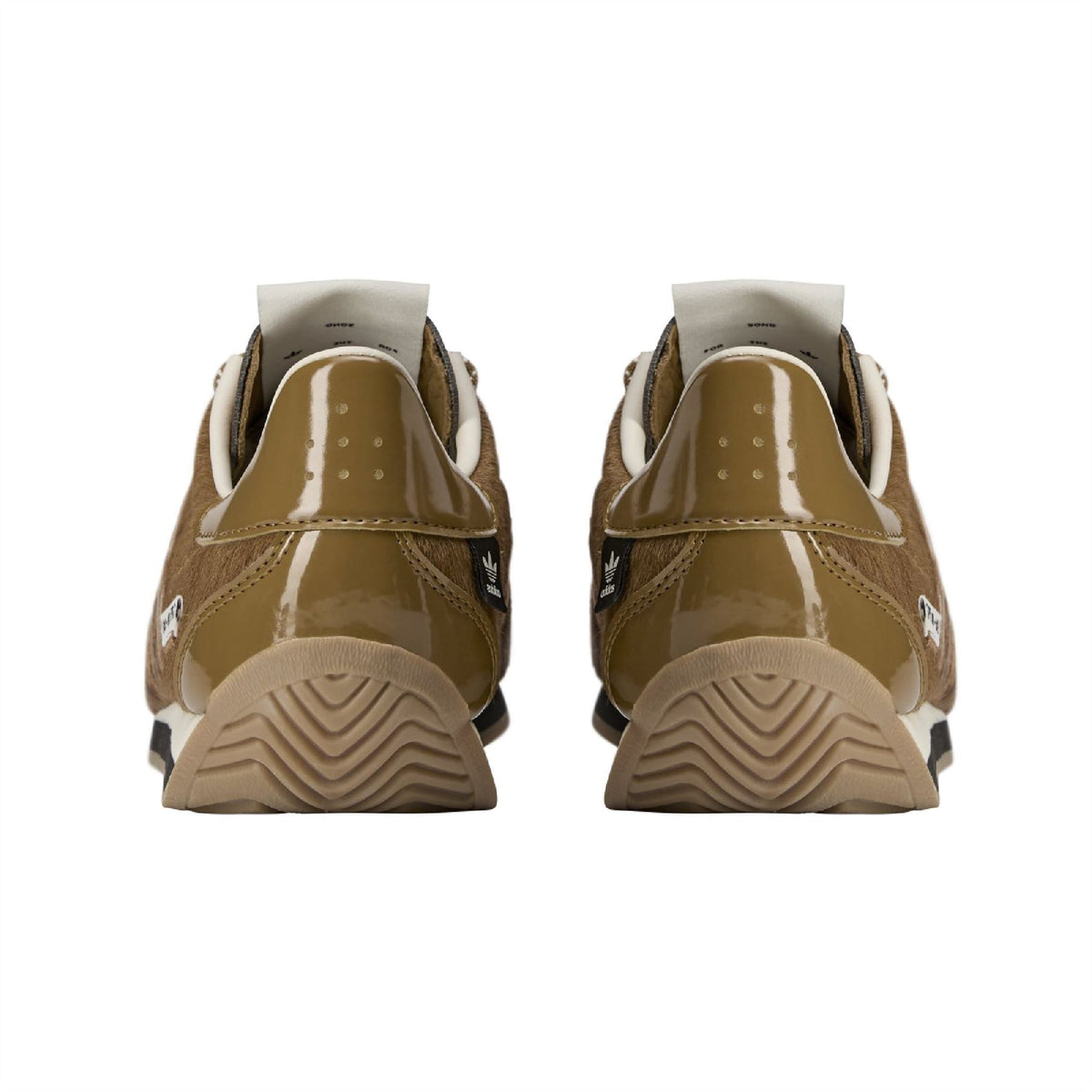 adidas Originals bronze sneakers, heel view with adidas mark and textured sole tread
