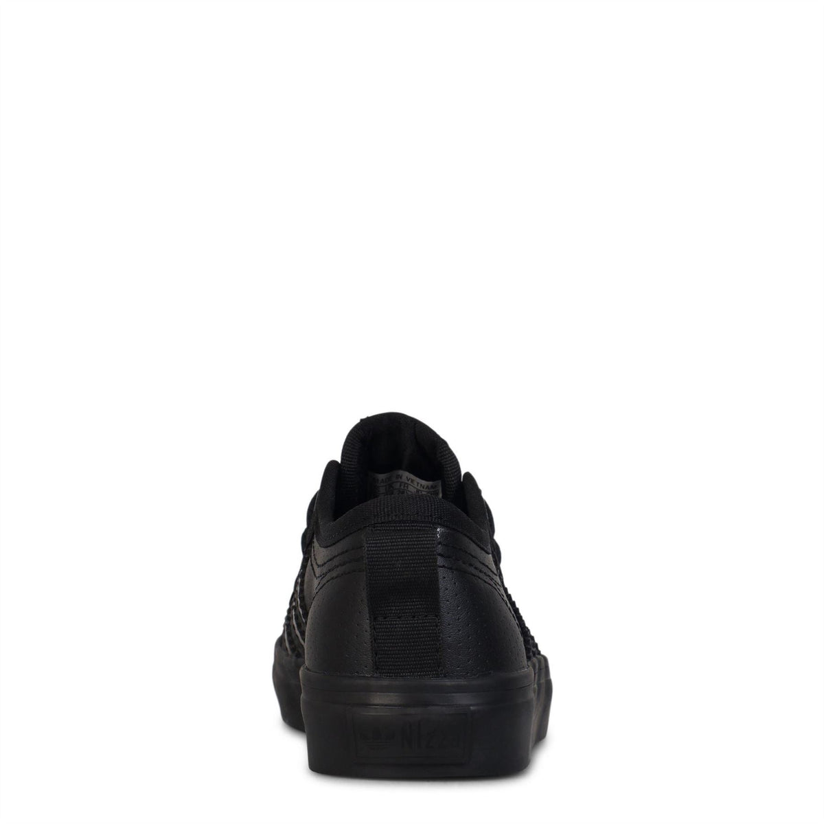 Adidas Originals juniors Nizza low top sneakers in children's size 10-2, featuring classic design and white canvas upper.