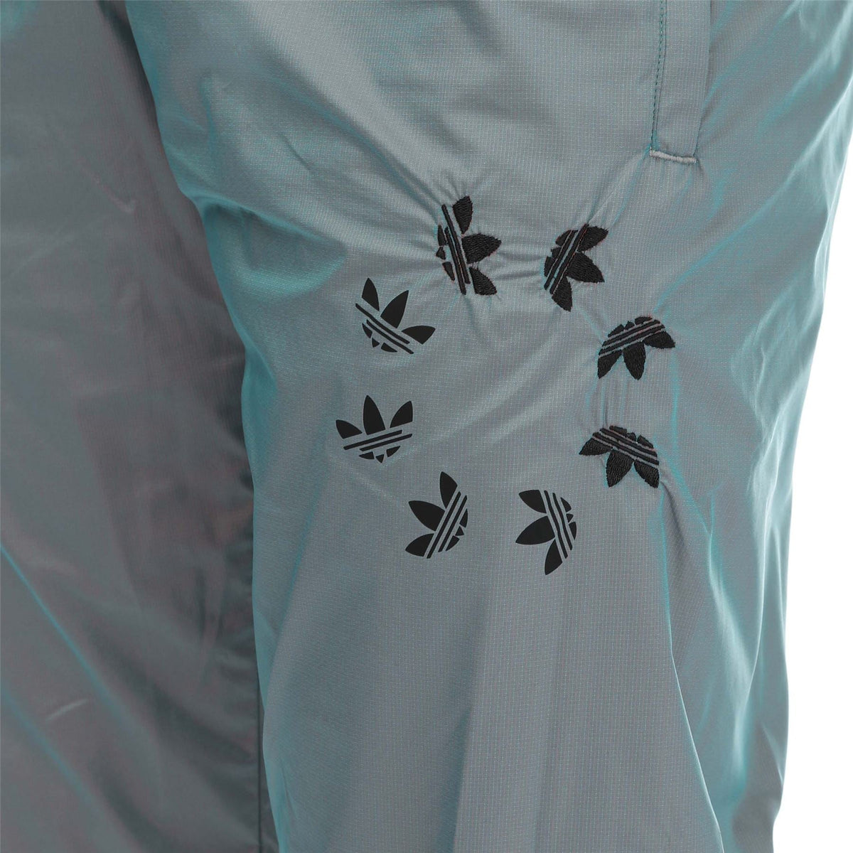 Light blue track pants with black trefoil logo all-over pattern