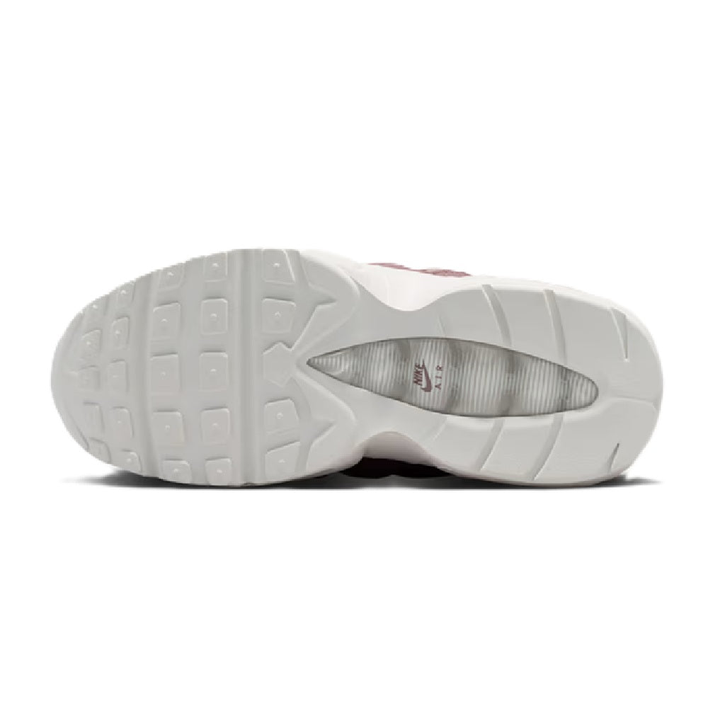 Kids' Nike Air Max 95 outsole view, white rubber tread with gray interior lining