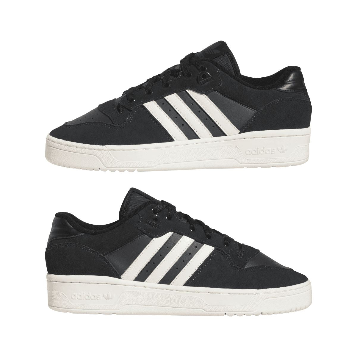 Two low-top trainers: black uppers with white three stripes, lace-up, and white sole