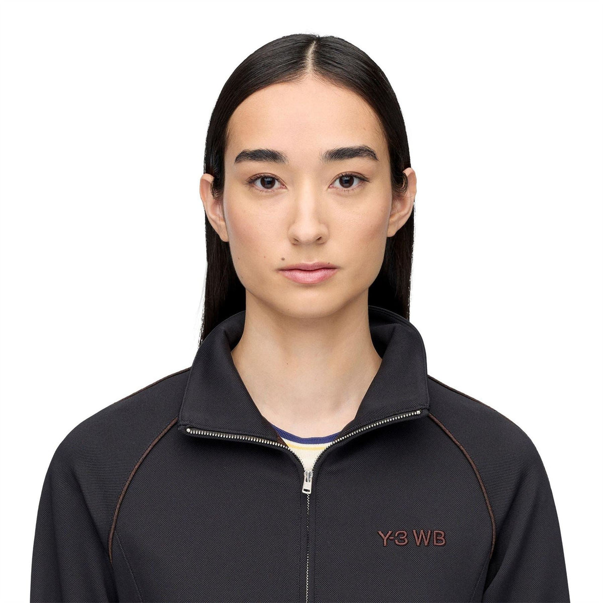 Black track jacket close-up with Y3 WB chest logo and full zip at stand collar