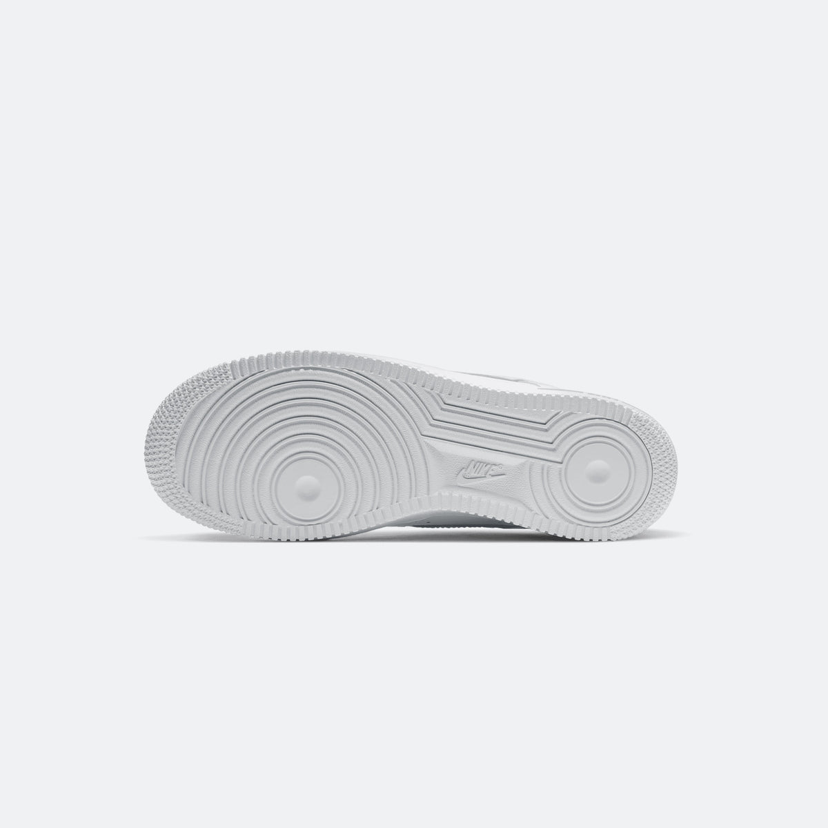 White Nike Air Force 1 low-top sneakers, textured rubber outsole view
