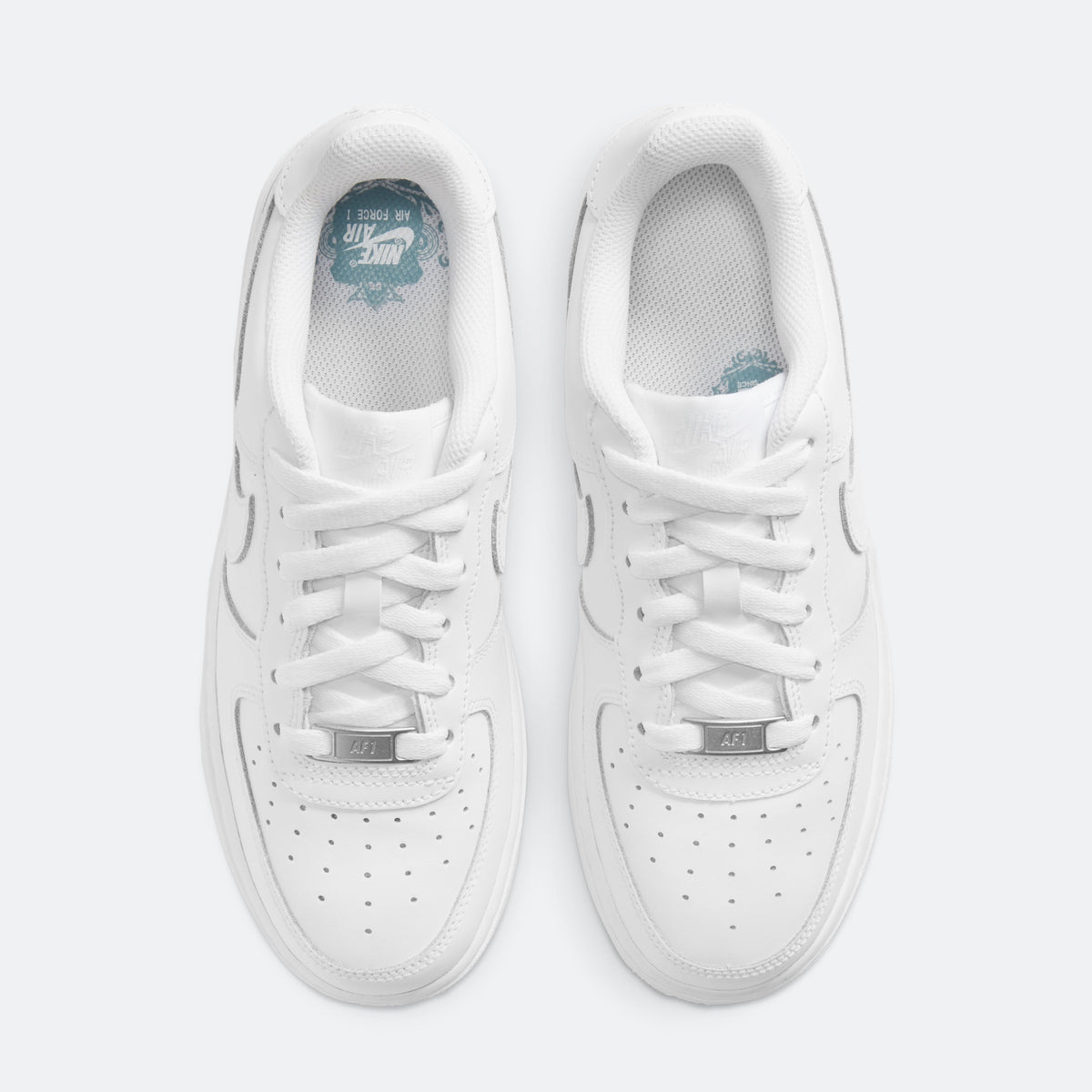 White Nike Air Force 1 sneakers with lace-up and blue-lined tongue label