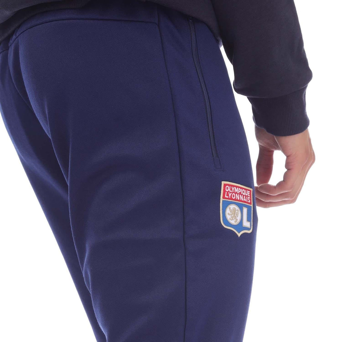 Navy track pants with Olympique Lyonnais crest patch and zip pocket detail
