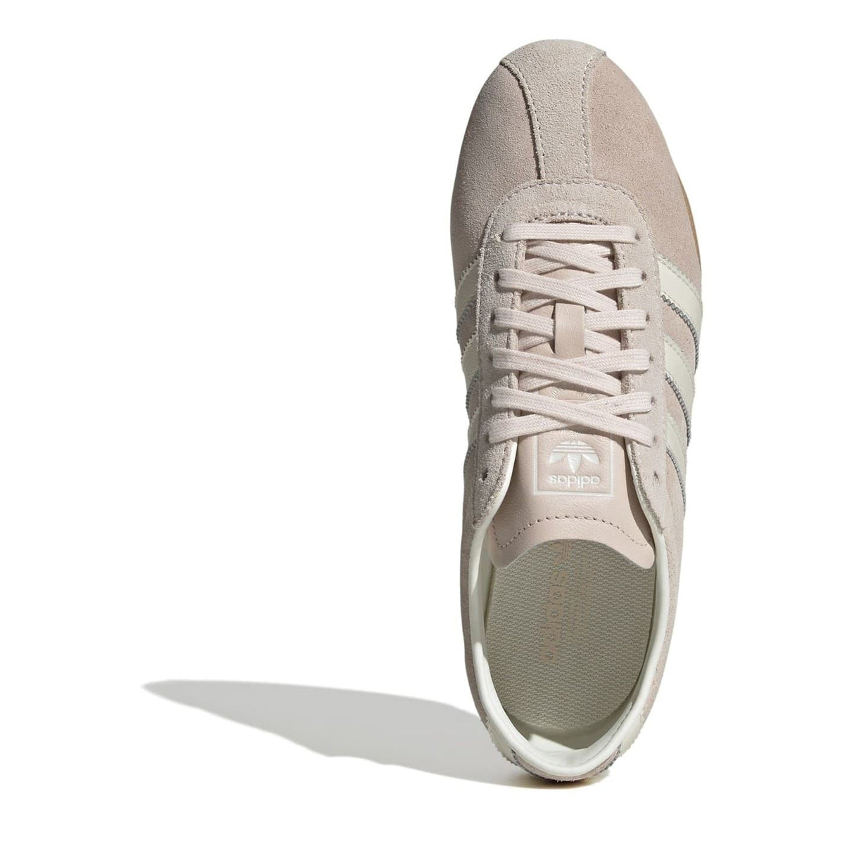 Light gray low-top lace-up sneakers with three metallic silver side stripes