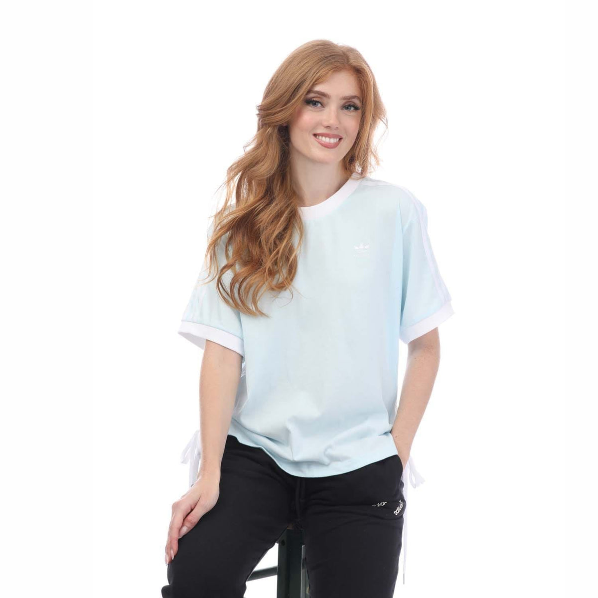Light blue crew-neck T-shirt with relaxed fit and side lace-up detail, short sleeves