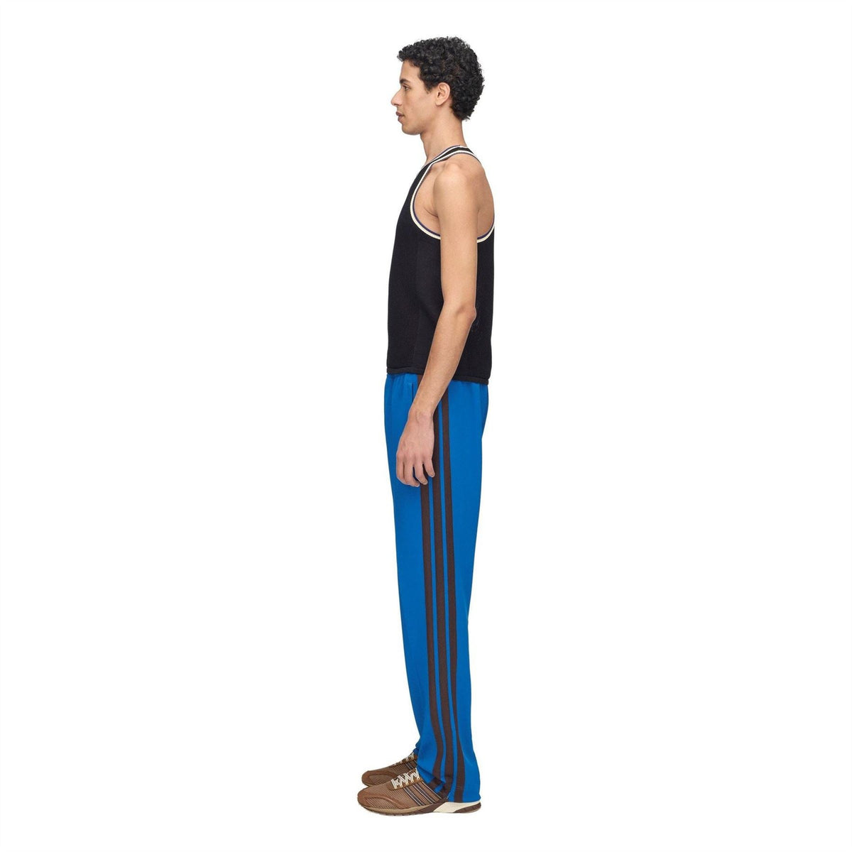 Men's blue track pants with dark side stripes, full-length profile