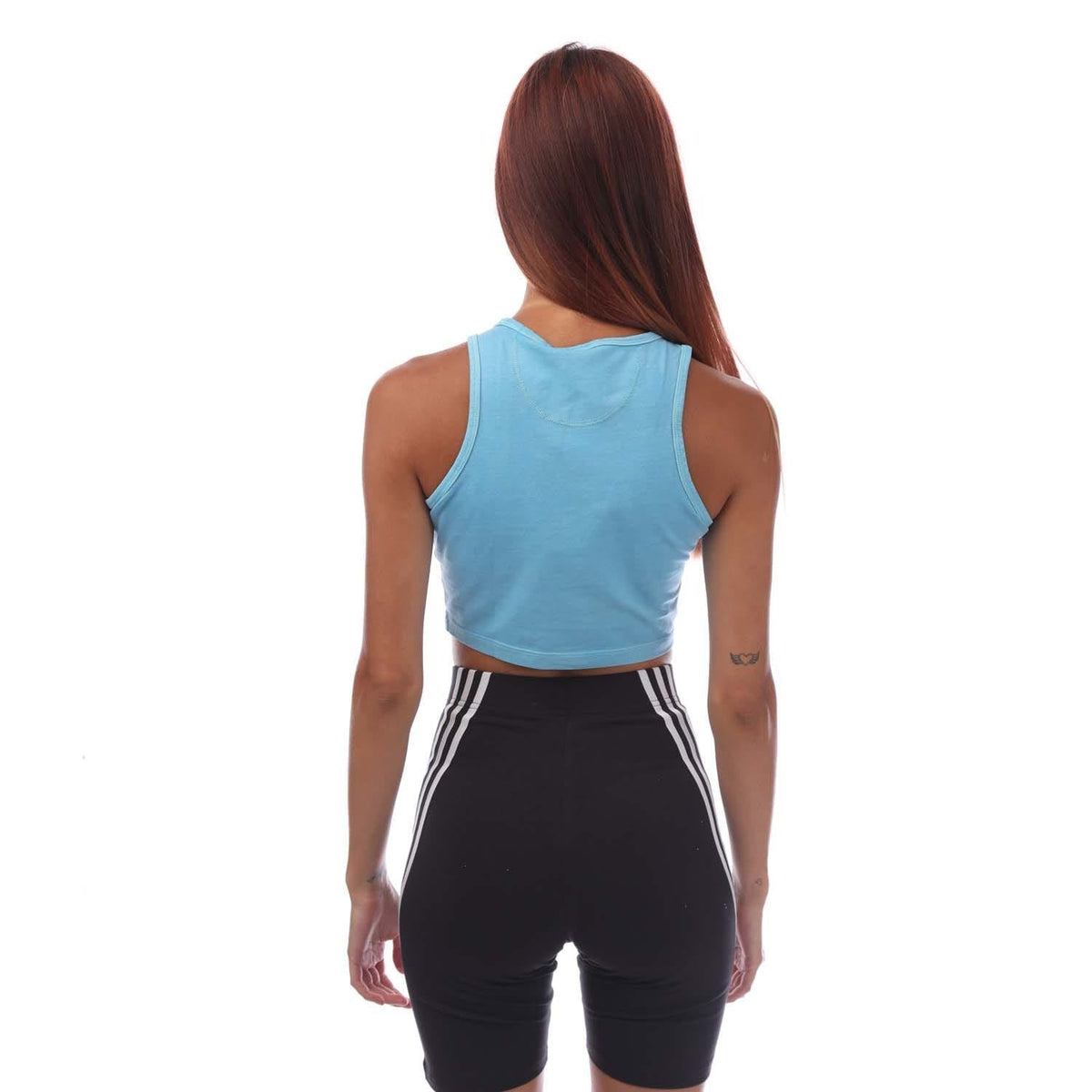 adidas Essentials+ blue crop tank top, sleeveless back view with curved hem