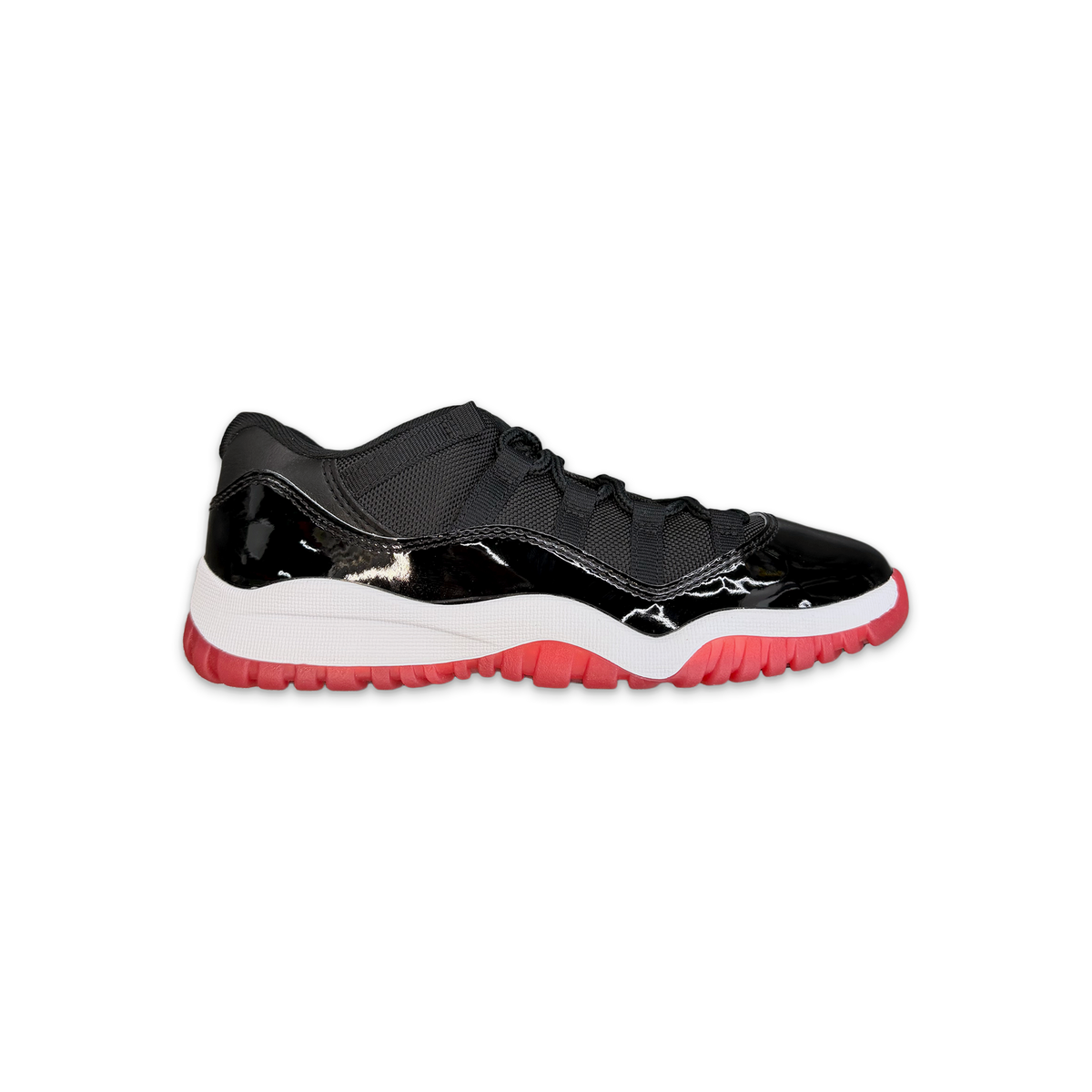 Kids Air Jordan 11 Low Retro sneakers, black mesh and patent leather, red accents