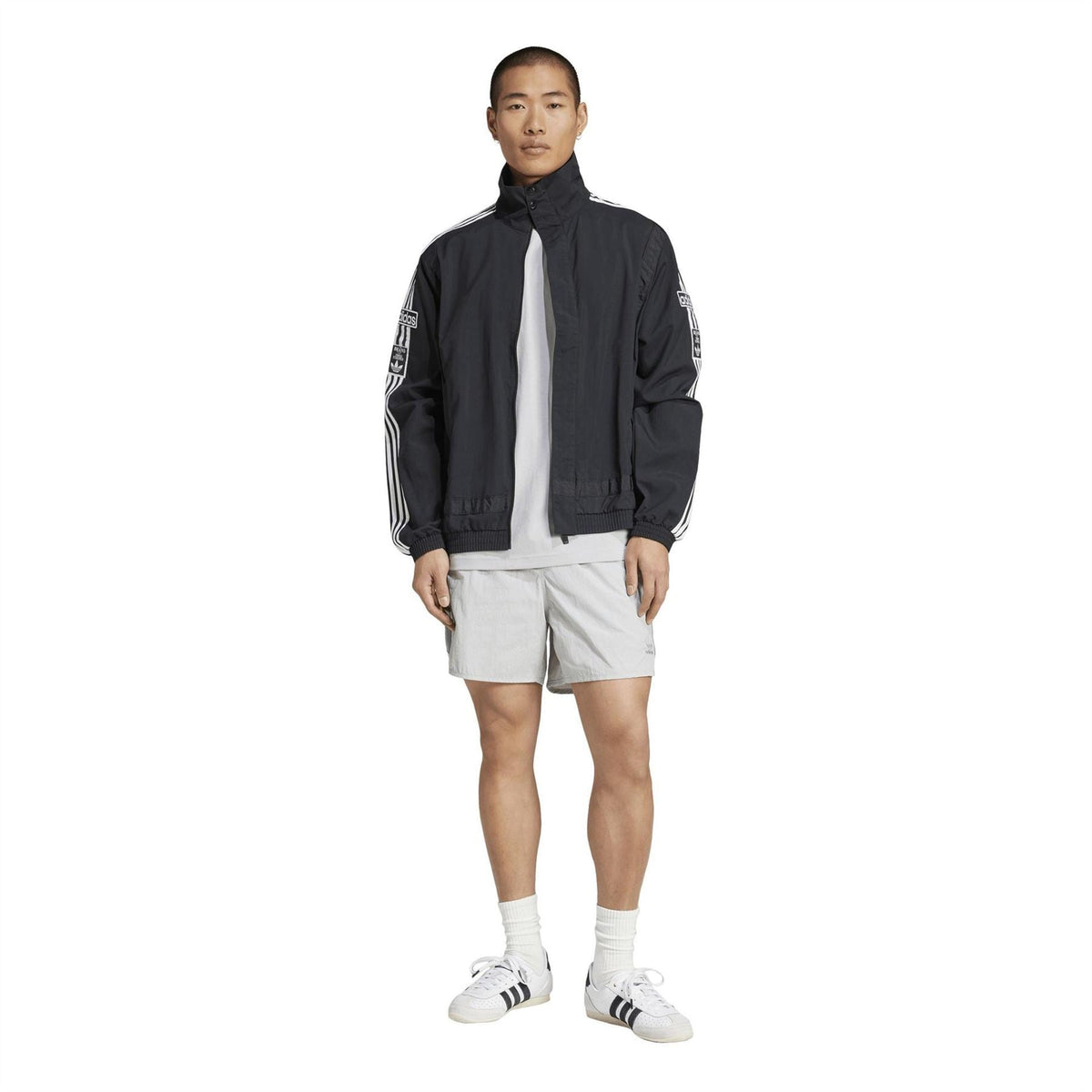 Black adidas zip-up track jacket with front zipper and white adidas logo