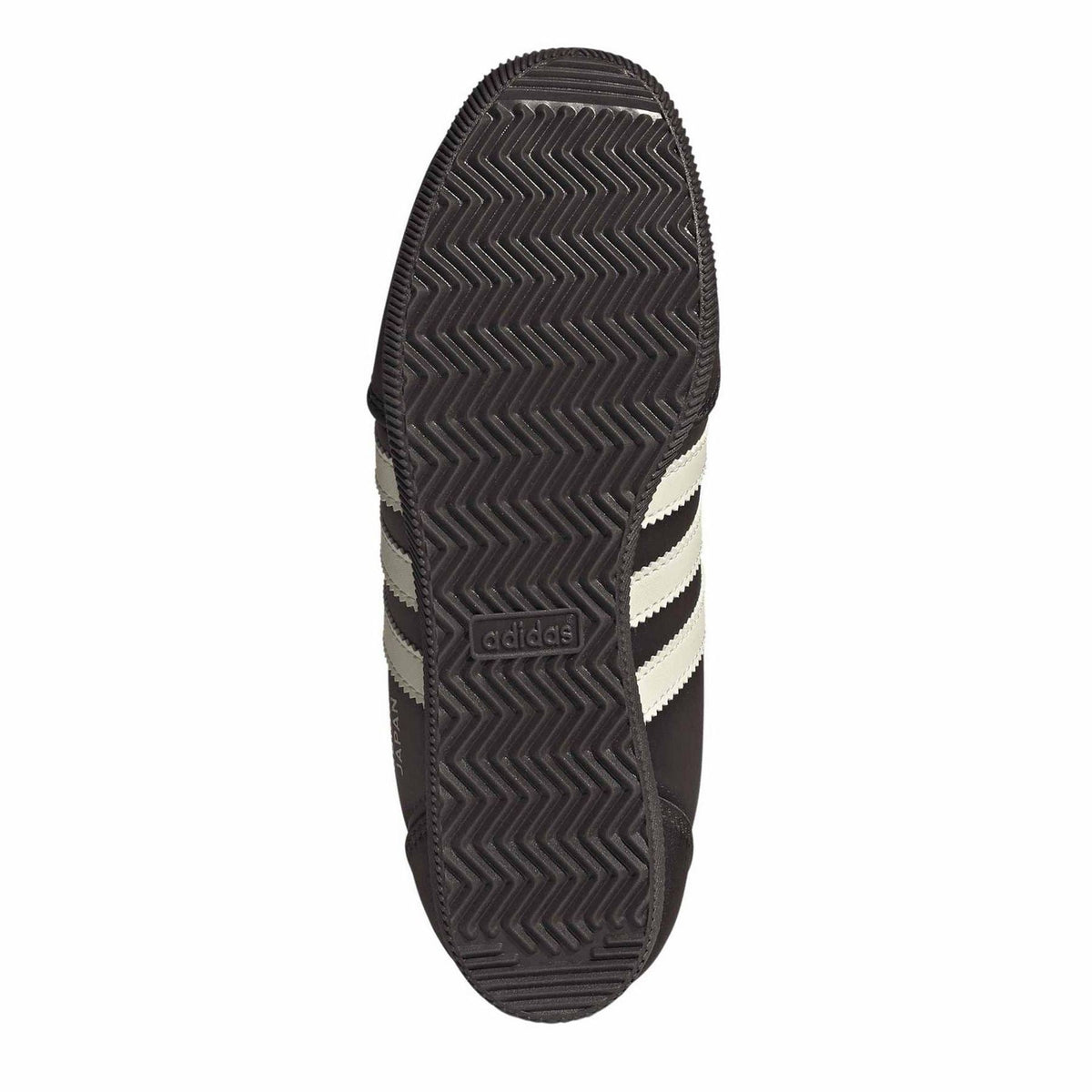 Adidas Originals sneaker outsole with zigzag tread and cream stripe detail
