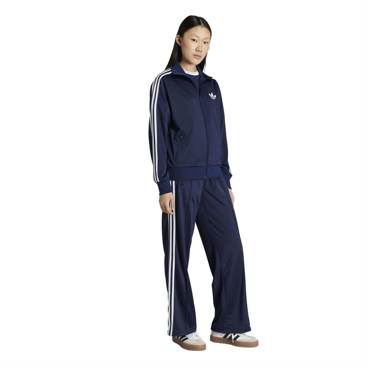 adidas Originals funnel-neck track jacket in dark indigo with front zip and white striped sleeves
