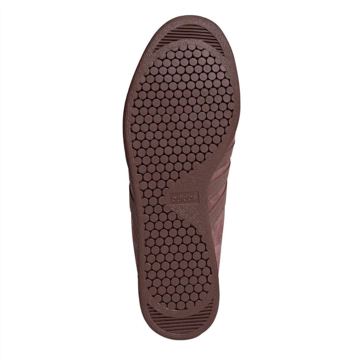 Burgundy sneaker outsole with textured rubber tread pattern