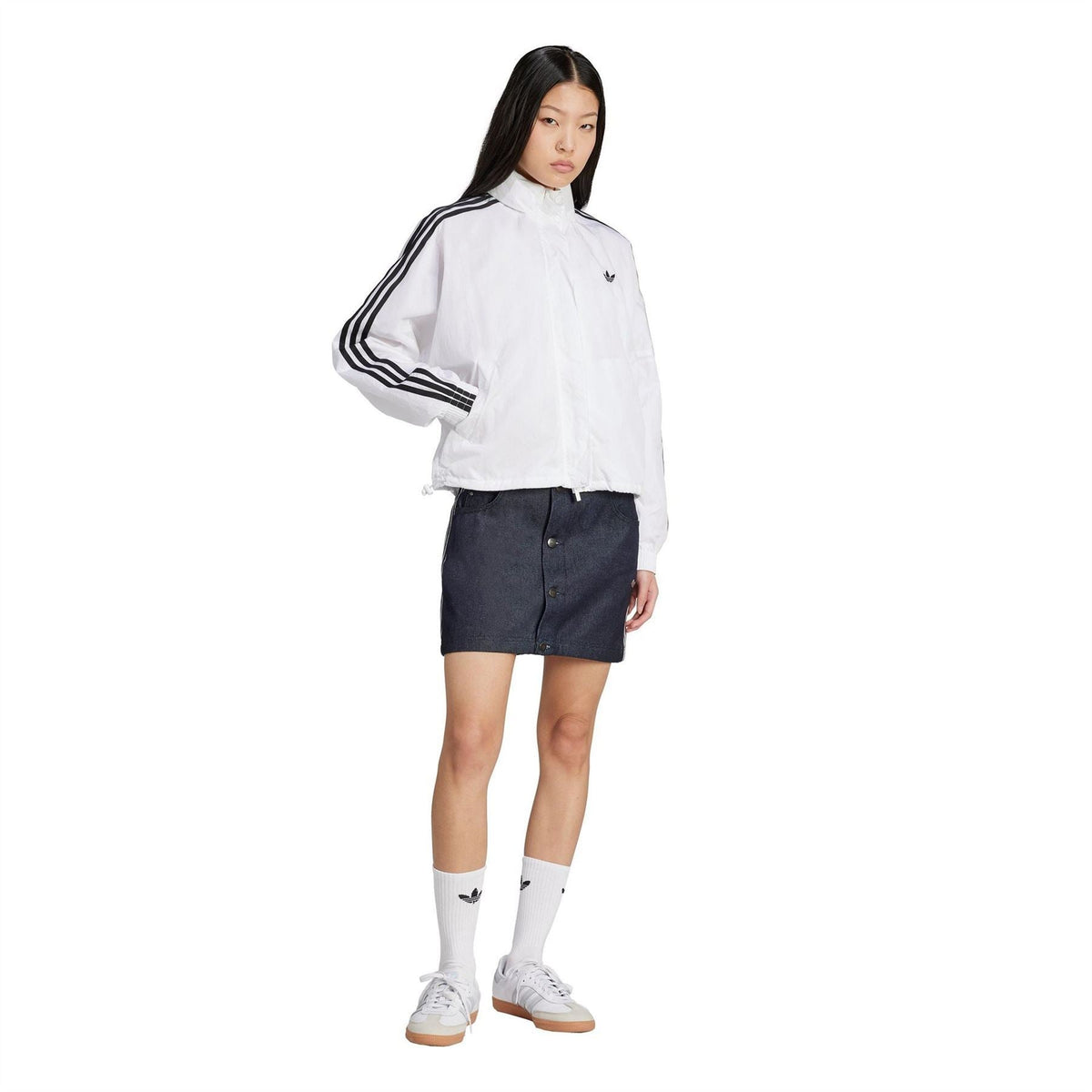 adidas Originals indigo denim skirt on model, front view with button closure