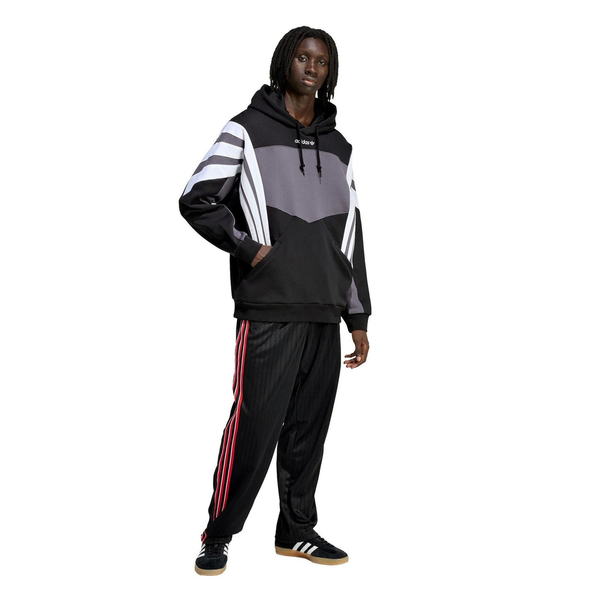 Black hoodie worn with grey paneling and white sleeve stripes, drawstring hood and pocket