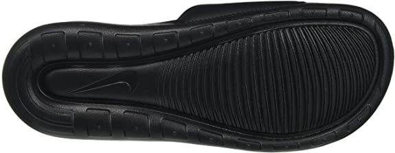 Black slide sandal outsole with textured tread and Nike branding