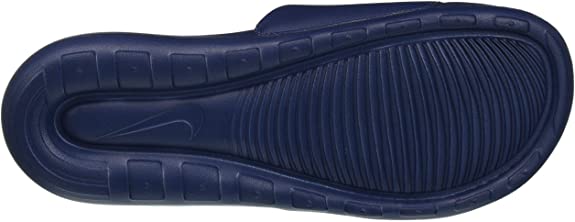 Navy rubber outsole view with molded traction pattern and curved edges.