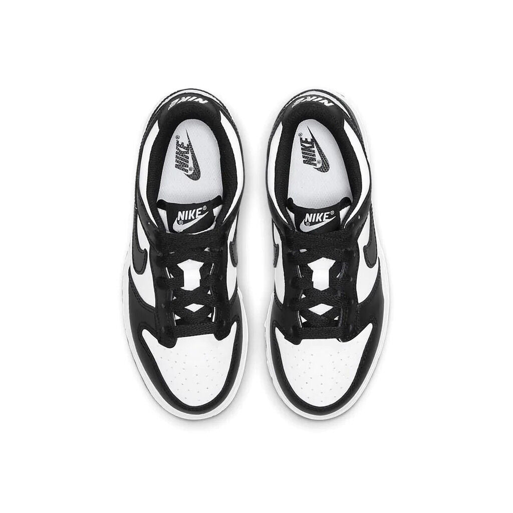 Toddler's Nike Dunk Low sneakers, top view with black laces on white-and-black uppers