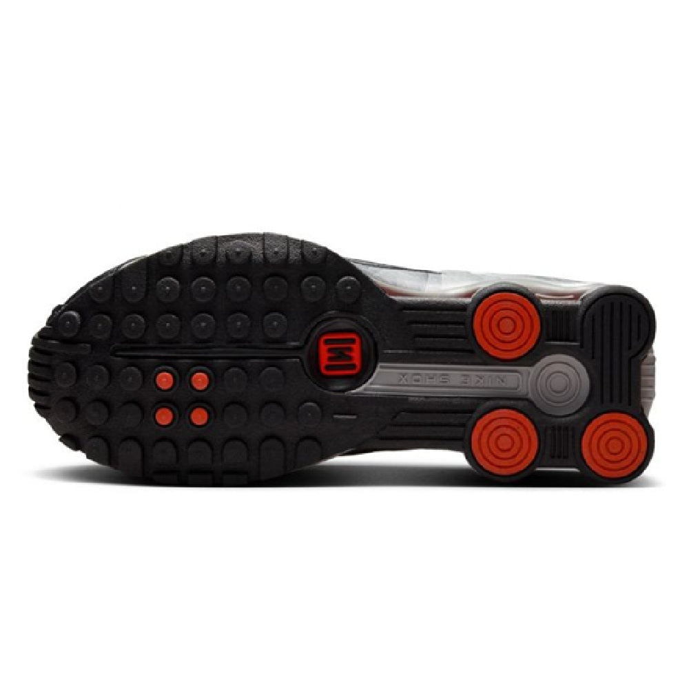 Kids' Nike Shox R4 outsole, black tread with red circular traction elements