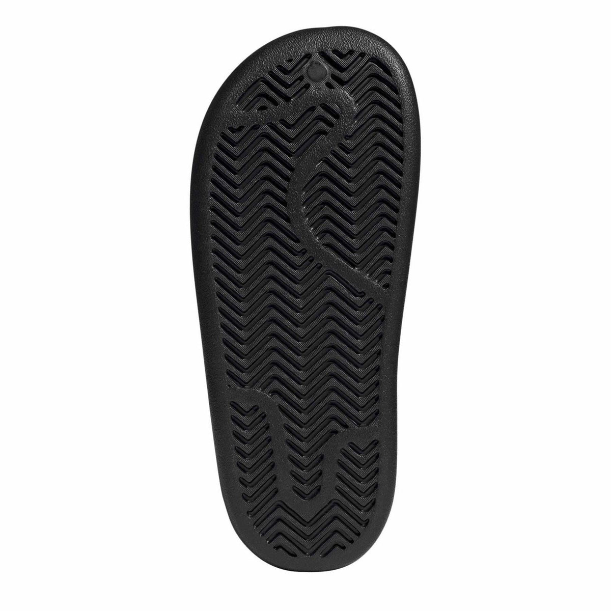 Black adidas slide sandal outsole with textured herringbone tread