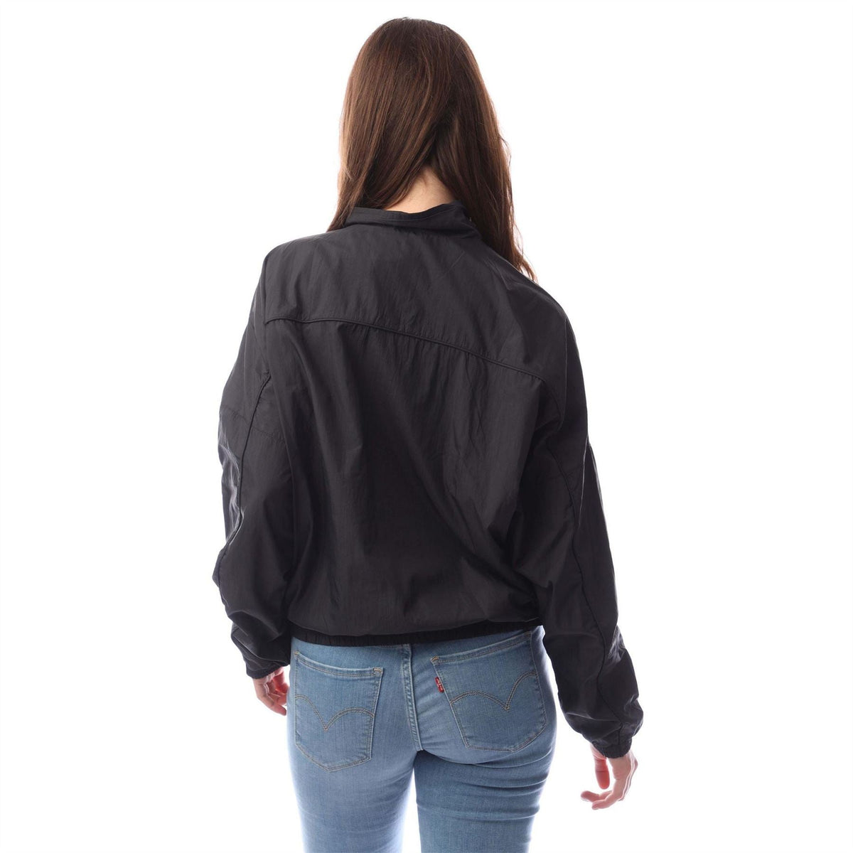 Black track jacket back view with stand collar and zip