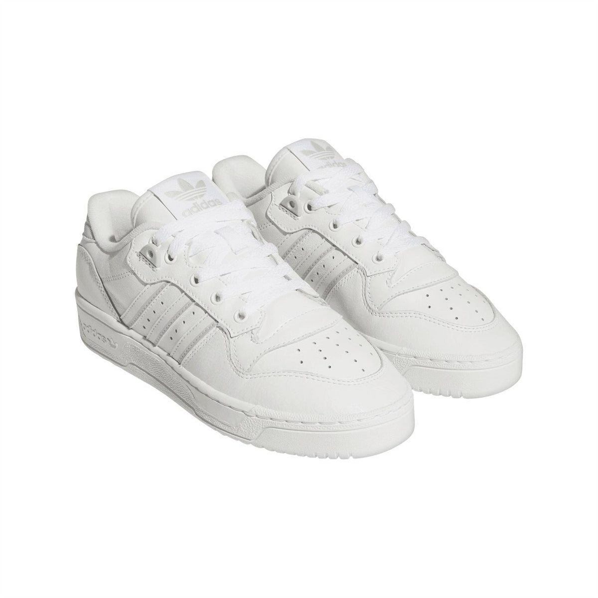 White adidas Originals low-top trainers, angled side view with lace-up front.