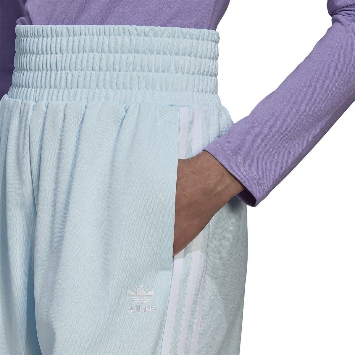 Light blue athletic sweat shorts with ribbed elastic waistband and side logo