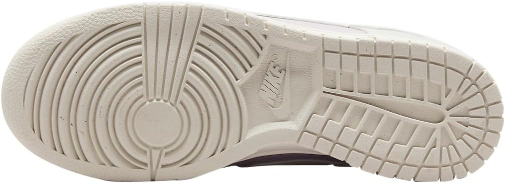 Nike Dunk Low outsole in light bone rubber, grid tread with circular pivot design.