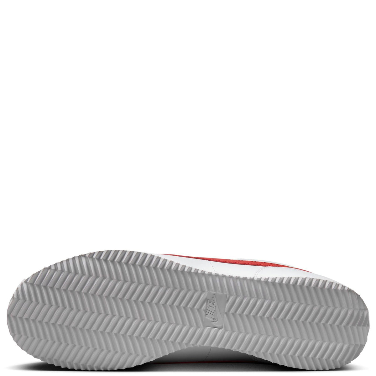 Nike Cortez sneaker outsole with textured tread and red edge on the heel
