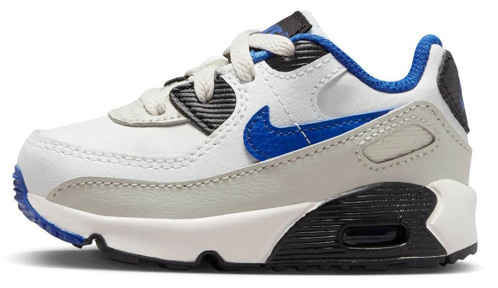 Toddler white low-top sneakers with blue laces, blue swoosh, and black heel air unit