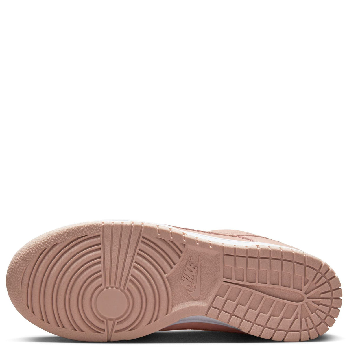 Pink Nike sneaker outsole view with textured rubber tread and branding
