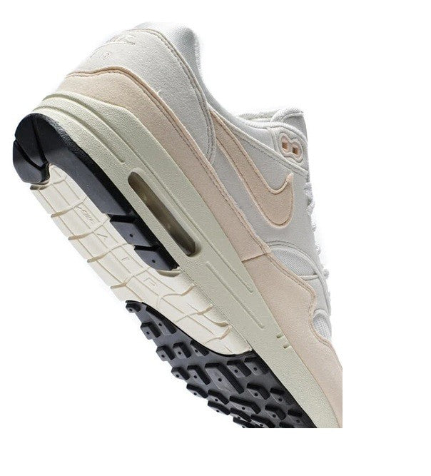 Women's Nike Air Max 1 sneaker sole, off-white midsole with dark rubber traction outsole
