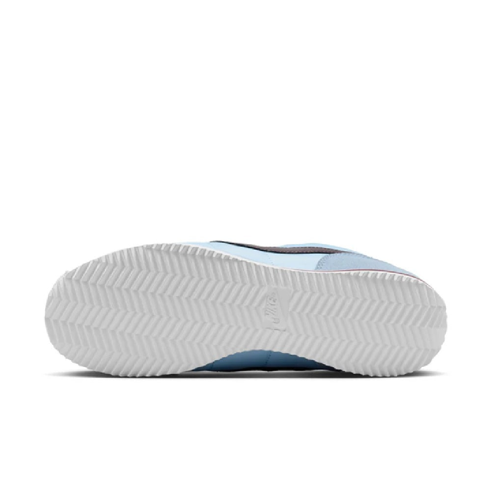 Nike Cortez outsole view with textured tread on light blue sneakers
